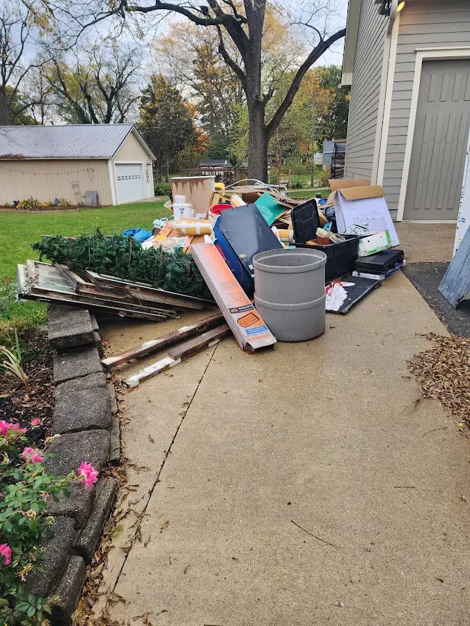 Dumpster being loaded with debris for Estate Cleanout Dumpster Rental in Palatine